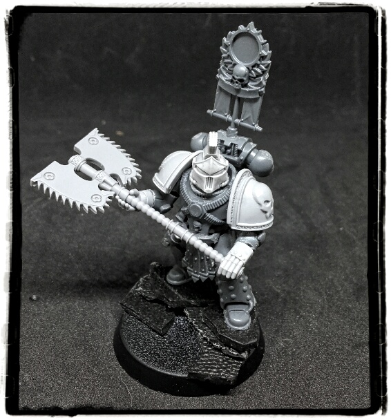 Space marine using a bloody huge chain axe